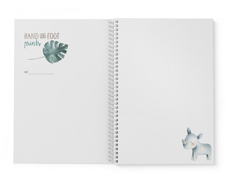 Puede incluir: Un cuaderno blanco de espiral con una hoja verde y el texto "HAND and FOOT prints" en la portada. La contraportada tiene una ilustraci&oacute;n de acuarela de un rinoceronte gris.