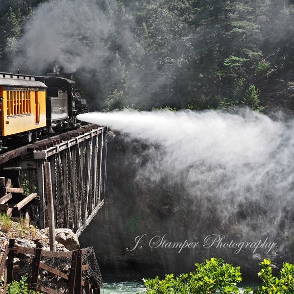 Crossing the Animas.  Narrow gauge in the Rockies.  Professional print in multiple sizes. Beautiful colors, great gift for railroad lover.