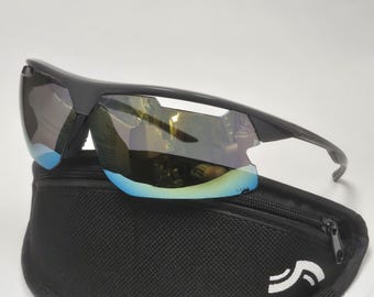 May include: Black sunglasses with a blue and gold mirrored lens and a black carrying case.