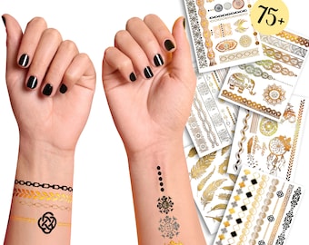 May include: A set of 75+ gold and black temporary tattoos featuring various designs, including geometric patterns, feathers, dreamcatchers, and an elephant. The tattoos are shown on a person's arms.