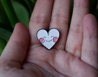 Pin: blushing heart.