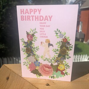 Greeting card: happy birthday cherub.