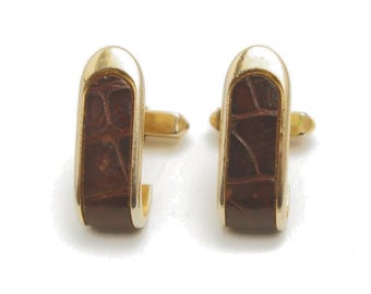 Gemelos vintage Swank de piel sintética: diseño de cocodrilo en tonos marrón y dorado de la década de 1960.