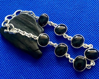Whitby Jet Bracelet  set in  sterling silver Natural polished stones Whitby Yorkshire U.K Local to us.