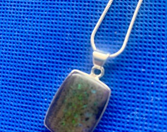 Black opal oblong pendant Andamooka opal rare polished Natural stones set in sterling silver.