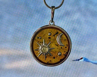 Amber moon and star pendant set in and with cognac amber  sterling silver and  snake chain .925