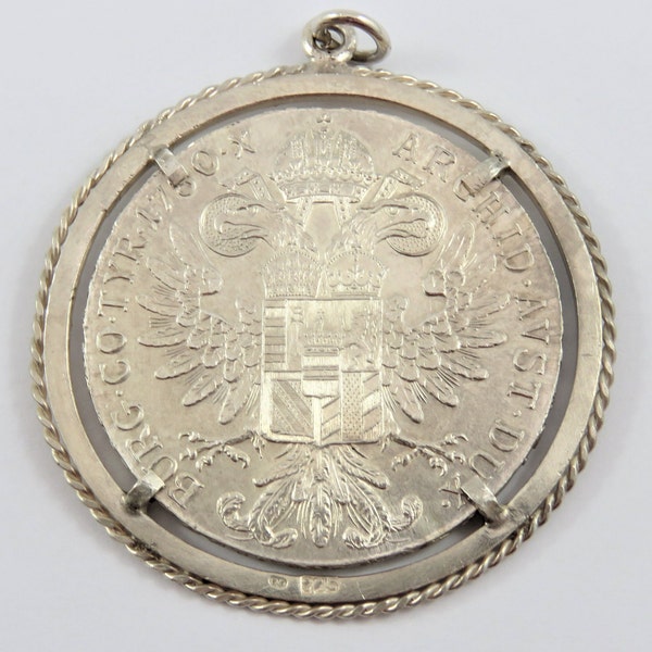 Austria 1780 Maria Theresa Silver Thaler Restrike Coin Pendant Securely Fastened By 4 Clasps in a Rope Style Bezel .