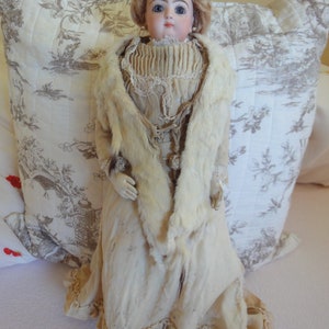 One antique Jumeau fashion doll dated 1880 closed mouth blue eyes antique doll dress
