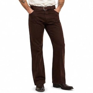 May include: Brown pants with a belt and pockets. The pants have a slight flare at the bottom and are paired with brown shoes. The pants are made of a solid, dark brown material.