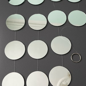 Garden mirror, Sun catcher silver mirror glass, length approximately 4’ feet. Mirror disk is approximately 2 inches.