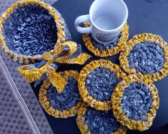 Bandana yellow coasters & basket holder. 6 Mug rugs in gray surrounded by bandana yellow.  Toothbrush knotted. Machine wash!