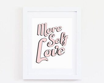 May include: A white framed print with the text "More Self Love" in pink lettering with black outlines.