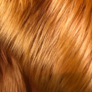Luxury snag  faux fur amber fabric