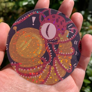 Astronaut fighting space alien (holographic glitter sticker)