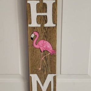 Flamingo Cartello di benvenuto su legno invecchiato.