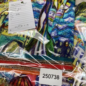 May include: A colourful, abstract-patterned top in a clear plastic bag. The top features a vibrant mix of blues, greens, yellows, and oranges. A tag indicates the shoulder seam to shoulder seam is 86 cm, and the length is 58 cm.