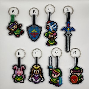 Handmade double sided cross stitch video game inspired keyring