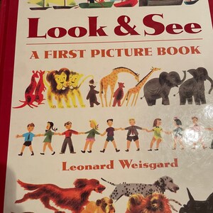 May include: A vintage children's book titled "Look & See: A First Picture Book" by Leonard Weisgard. The cover features colorful illustrations of sailboats, animals, and children.