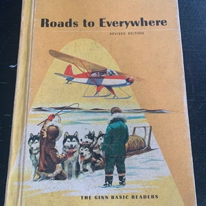 May include: A vintage children's book titled "Roads to Everywhere" with a revised edition label. The cover features a red and white airplane flying over a snowy landscape with a group of dogs and a person in a green jacket. The book is part of the Ginn Basic Readers series.