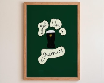 May include: A framed print with a dark green background and a wooden frame. The print features a black and white illustration of a pint of Guinness with the words "get Dad a guinness" in a handwritten style.