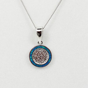 May include: A silver chain necklace with a round pendant featuring a blue opal stone and Hebrew lettering.