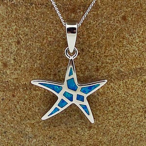 May include: A silver pendant necklace featuring a blue opal starfish design.