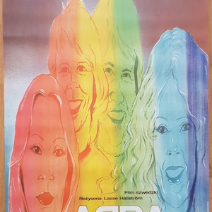 May include: A vintage ABBA film poster with four faces in a rainbow gradient. The band's name is in white block letters. The poster includes text in Polish and Swedish, and the director's name is Lasse Hallström.