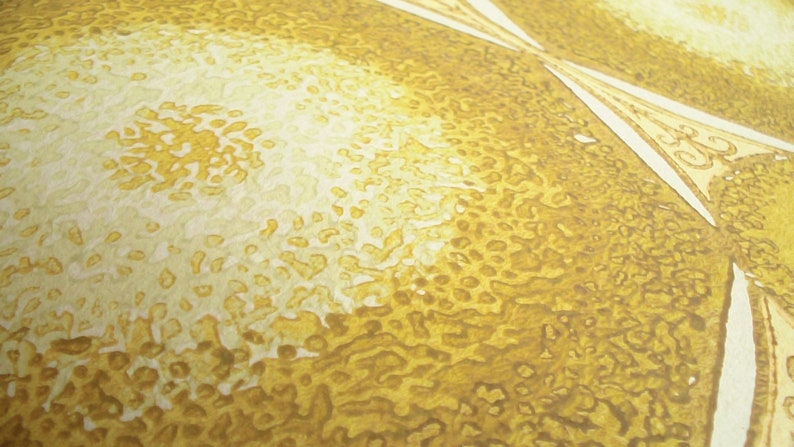 May include: Close-up of a textured surface with a pattern of white and yellow circles. The surface is a light yellow color with a darker yellow pattern.