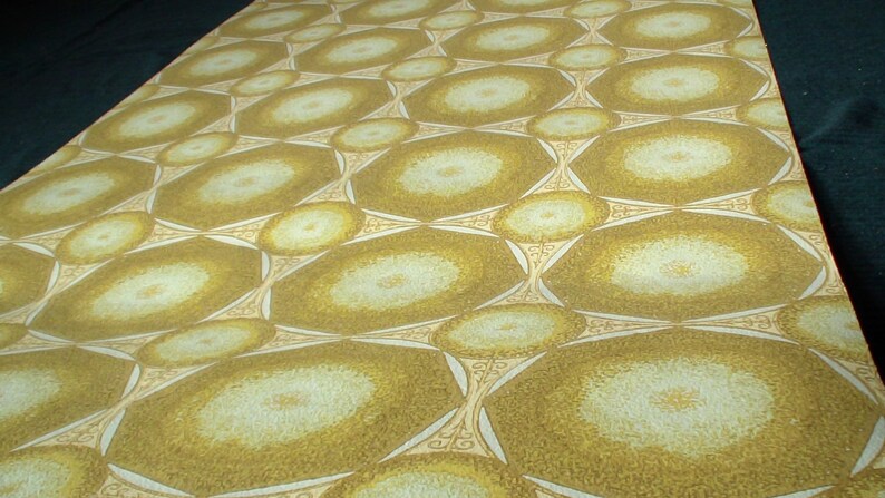 May include: A repeating pattern of overlapping circles in shades of brown and white on a wallpaper.