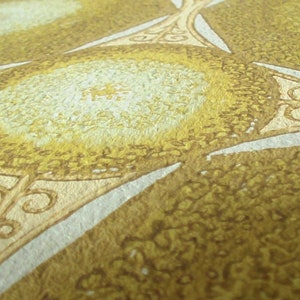 May include: A close-up of a wallpaper pattern with a star shape in the center. The star is made of a light brown color and has a white outline. The background is a light yellow color with a textured pattern.