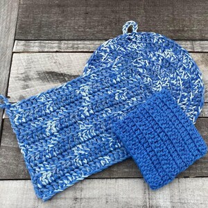 May include: Three crocheted pot holders in blue and white. Two are round and one is square. The round pot holders have a white center and blue outer edge. The square pot holder has a blue and white pattern.