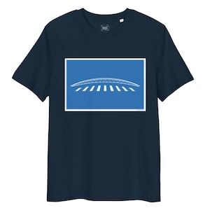May include: Navy blue t-shirt featuring a white architectural design on a blue background. The design depicts a curved structure with a series of parallel lines. The shirt has a crew neck and short sleeves. The text "ground designs" is printed on the upper left.