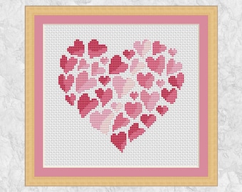 Puede incluir: Un patrón de punto de cruz de un corazón formado por corazones más pequeños en tonos de rosa y rojo.