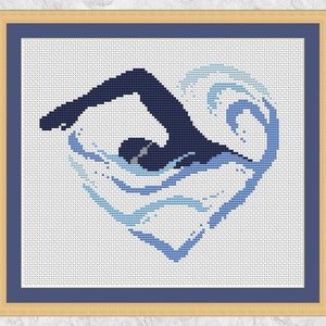 May include: Cross stitch pattern of a swimmer in a blue and white heart-shaped wave.