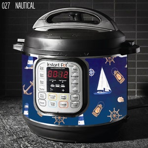 May include: A blue and white Instant Pot with a nautical themed design. The design features lighthouses, anchors, sailboats, and steering wheels. The Instant Pot has a digital display that reads "8:8:88".