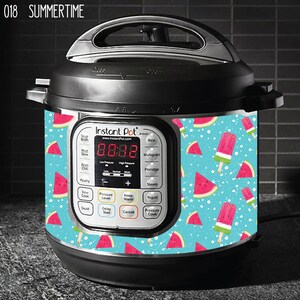 May include: A black Instant Pot electric pressure cooker with a blue and white patterned design featuring watermelon slices and popsicles. The design is printed on the side of the cooker. The display shows the time 08:08.