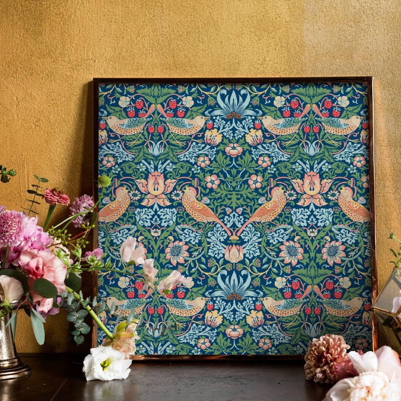 May include: A framed print of a vintage floral pattern with birds and berries. The pattern is in shades of blue, green, pink, and orange. The frame is a dark brown wood.