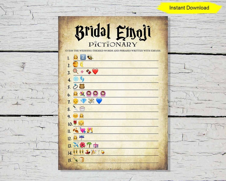 May include: A printable Bridal Emoji Pictionary game with a vintage parchment paper design. The game features a list of wedding-themed words and phrases represented by emojis. The words are written in a decorative font.