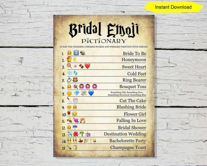 May include: A printable Bridal Emoji Pictionary game with a vintage parchment paper background. The game includes wedding-themed words and phrases written with emojis. The words include "Bride To Be", "Honeymoon", and "Champagne Toast". The words are written in black text.