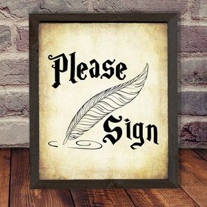 May include: A vintage-style sign with a black frame and a white background. The sign says "Please Sign" in a black, stylized font. A black and white illustration of a quill pen is next to the text.
