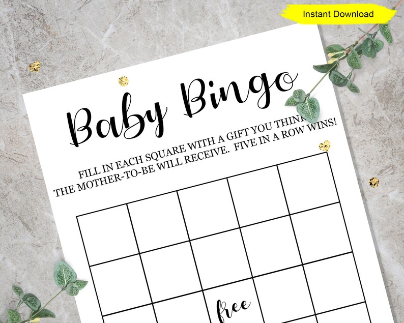 May include: A printable baby bingo card with a black and white grid and the text "Baby Bingo" at the top. The text below the grid reads "Fill in each square with a gift you think the mother-to-be will receive. Five in a row wins!" and "free" is written in the centre square.
