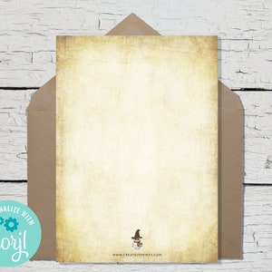 May include: A blank, cream-colored card with a vintage, aged texture. The card has a small illustration of a snowman wearing a hat and scarf in the bottom right corner. The text "www.createitprints.com" is printed below the illustration.