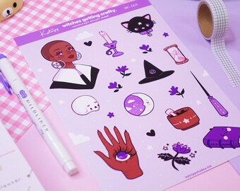 May include: A sheet of stickers featuring a variety of witchy illustrations, including a woman in a black and white outfit, a black cat, a witch's hat, a cauldron, a hand with an eye, and a book. The stickers are on a purple background with white stars and hearts.