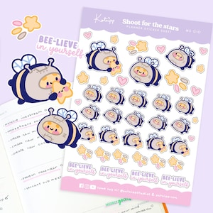 May include: A sheet of planner stickers featuring a cartoon bee wearing a spacesuit and holding a star. The stickers are in various sizes and include the text "BEE-LIEVE in yourself" and "Shoot for the stars".