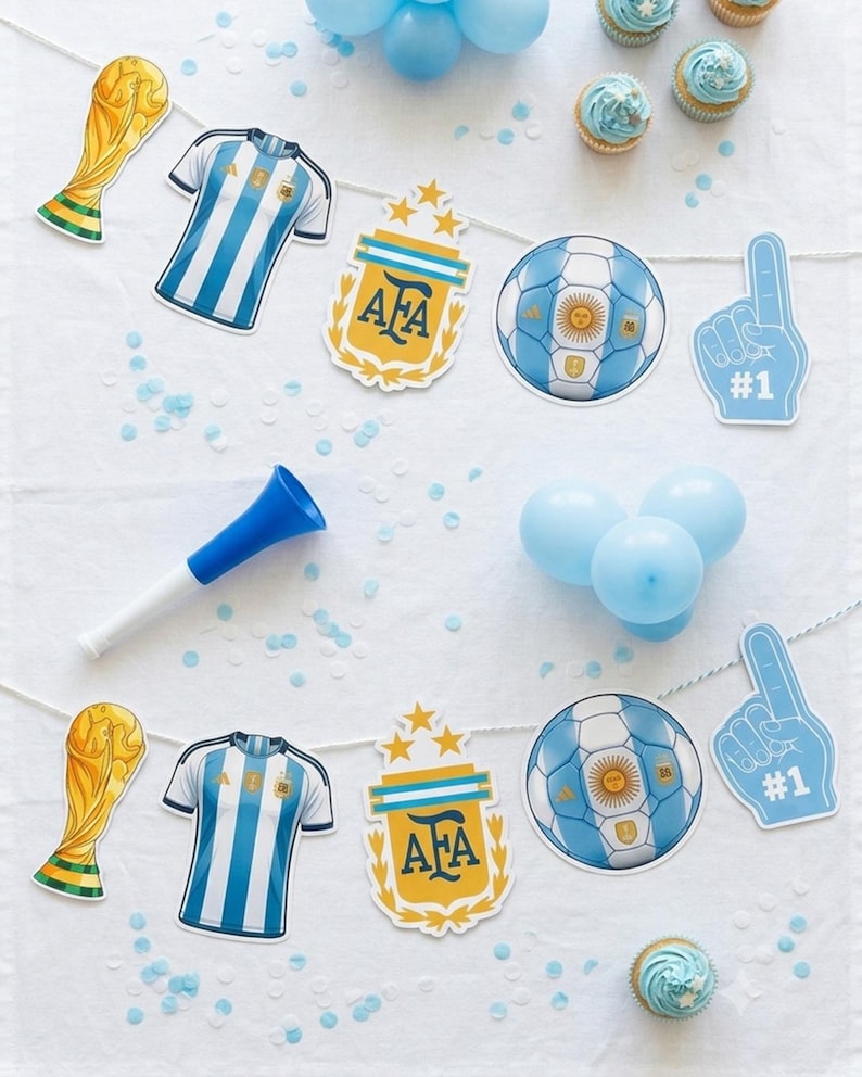 May include: A party banner featuring two repeating sets of cutouts: a gold trophy, a blue and white striped jersey, an AFA crest with three stars, a soccer ball with the Argentina flag design, and a blue foam finger with the text #1.