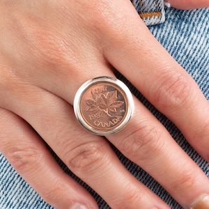 Spinning coin ring hot sale