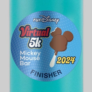May include: A turquoise blue water bottle with a black lid and handle. The bottle has a sticker on it that says "runDisney Virtual 5k Mickey Mouse Bar 2024 Finisher".