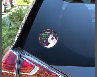 May include: A circular sticker featuring a teal-skinned character in a white wedding dress and veil holding a purple bouquet. The text reads Eternal Waltz and Virtual Miles with the runDisney logo above. The sticker is applied to a car window.