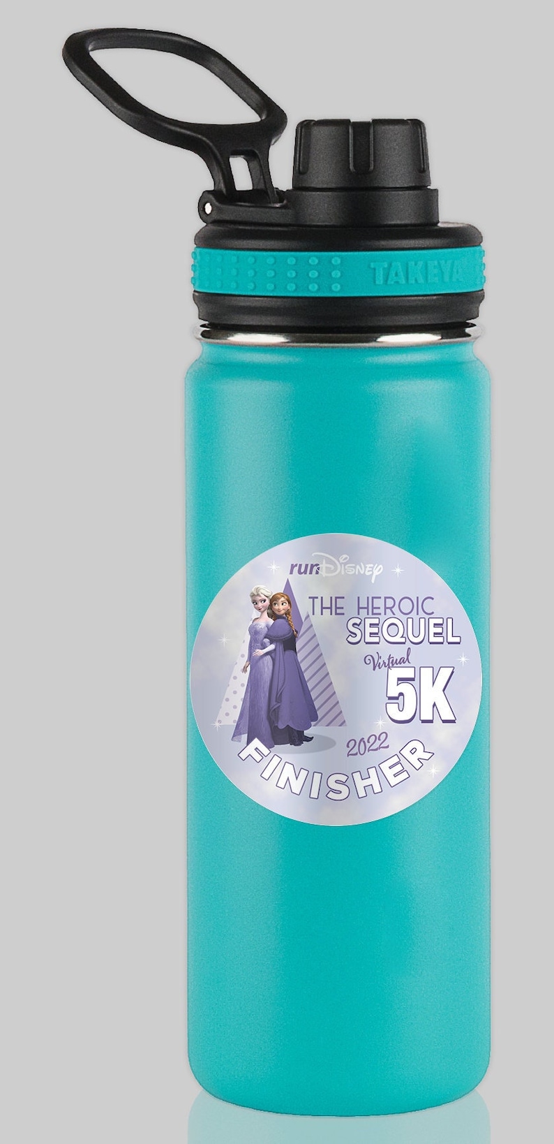 May include: A turquoise water bottle with a black lid and handle. The bottle has a sticker with the text "runDisney The Heroic Sequel Virtual 5K 2022 Finisher" and an image of Elsa and Anna from Frozen.