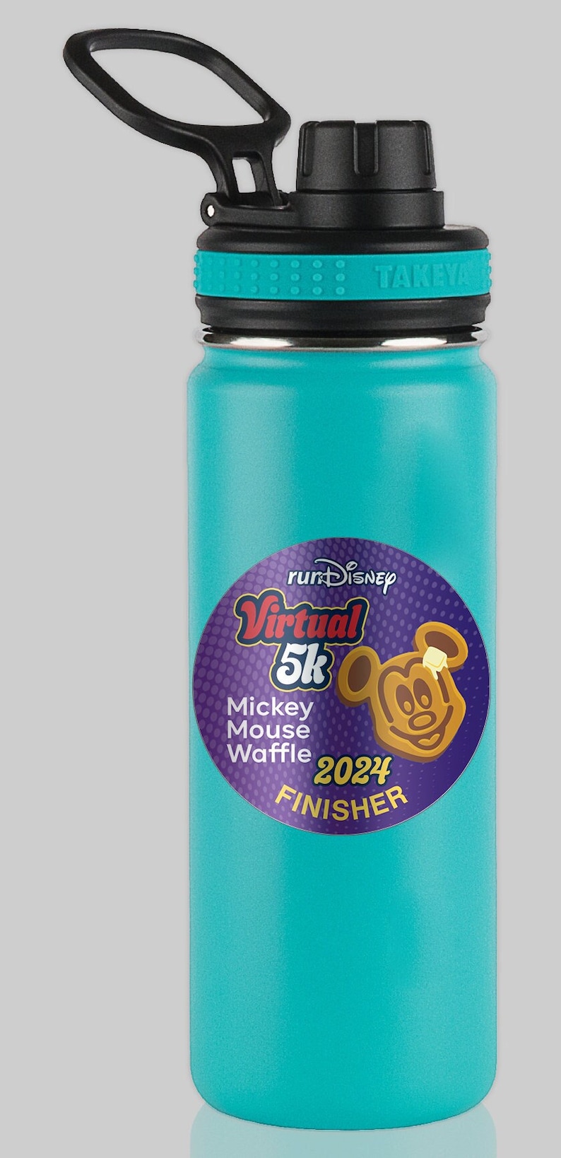 May include: A teal water bottle with a black lid and handle. A round sticker features a Mickey Mouse waffle design and the text "runDisney Virtual 5K 2024 Finisher."